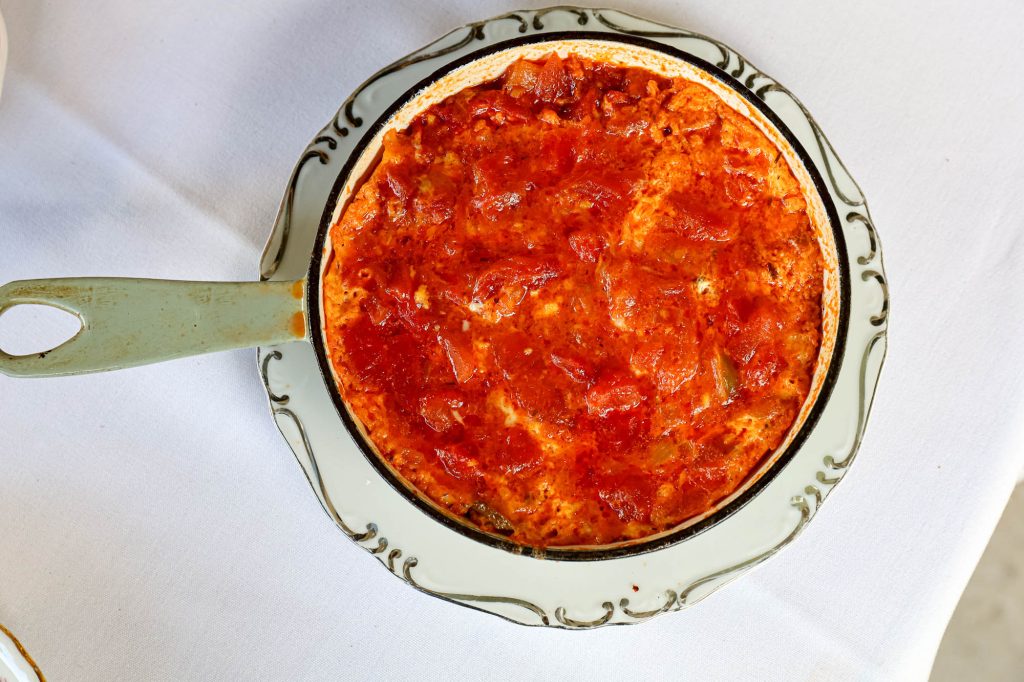 Authentic Turkish menemen served at one of the best brunch in Miami destinations, featuring fresh tomatoes, peppers, and perfectly cooked eggs.
