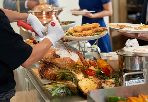 Professional Thanksgiving caterer serving roasted turkey in Chicago's Jefferson Park neighborhood