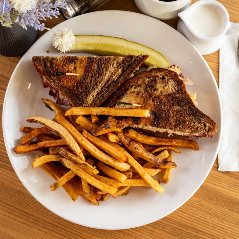 Reuben Melt sandwich with fries served at 5800 North Cafe