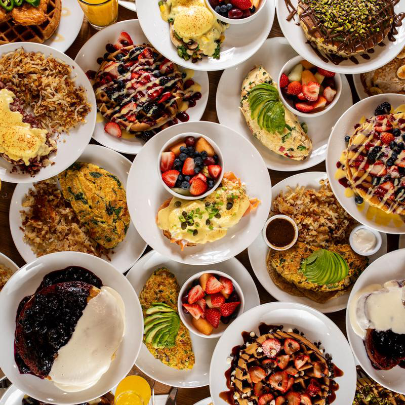 A picture showing multiple breakfast food dishes