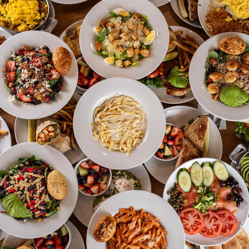 A picture showing multiple brunch dishes by 5800 North Cafe