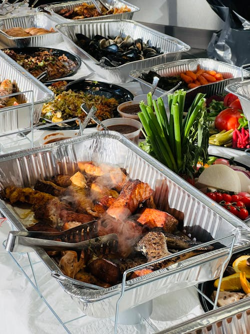 Office lunch catering setup with multiple meal options arranged for employees.