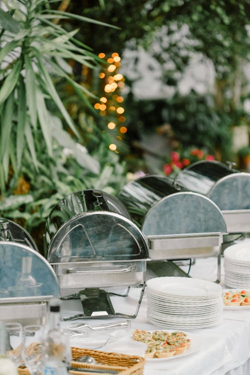 A table with plated dishes and dishware.