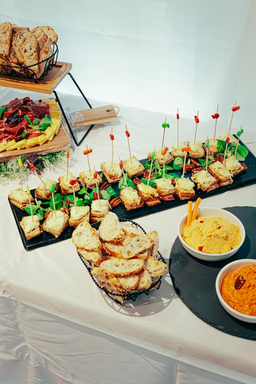 A buffet table with an assortment of snacks for reunion catering