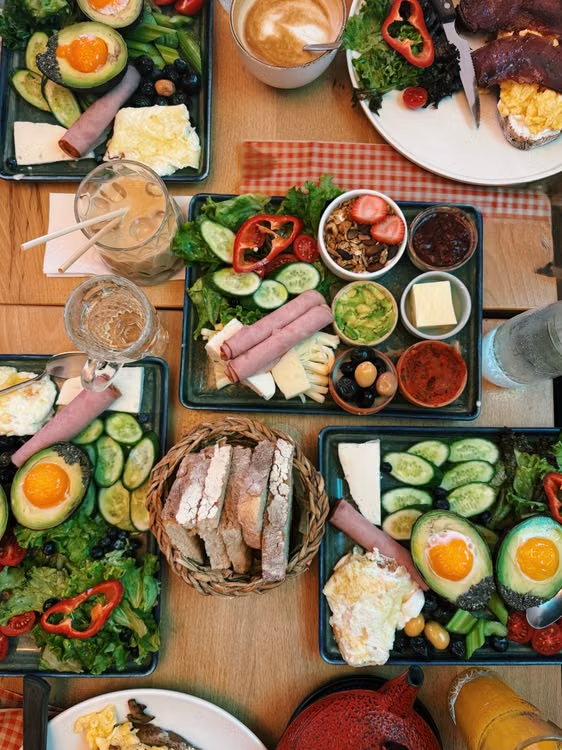 top-view of a brunch spread on a table with fresh ingredients