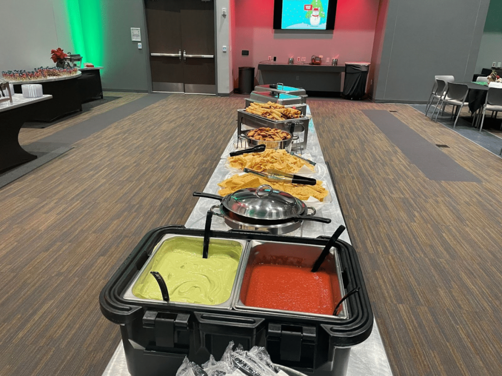 A wedding buffet featuring Tex-Mex dips like guacamole and salsa.