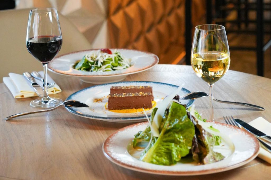 Weekday lunch entree paired with white wine at Marsanne Mediterranean restaurant in Chelsea, NYC